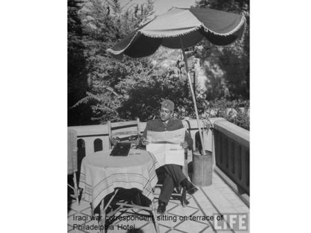 Iraqi war correspondent sitting on terrace of Philadelphia Hotel.