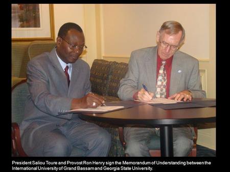 President Saliou Toure and Provost Ron Henry sign the Memorandum of Understanding between the International University of Grand Bassam and Georgia State.