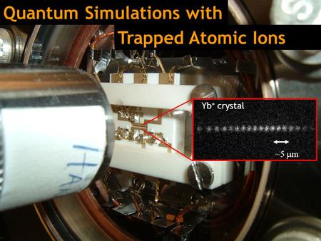 Quantum Simulations with Yb + crystal ~5  m Trapped Atomic Ions.