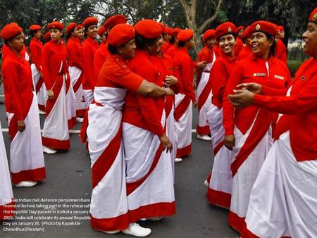 Female Indian civil defence personnel share a moment before taking part in the rehearsal for the Republic Day parade in Kolkata January 4, 2015. India.