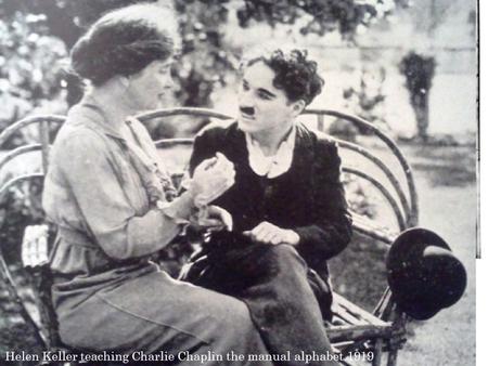 Helen Keller teaching Charlie Chaplin the manual alphabet 1919