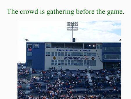 The crowd is gathering before the game.. The game ball comes by air.