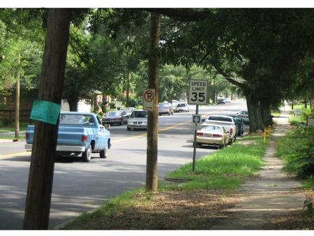 Chapter 2. Observation Skills   Are there cars parked on the sides of the road?   What color is the pickup truck driving in the road?   Any minivans.