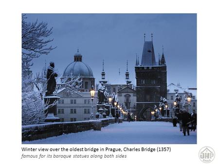 Winter view over the oldest bridge in Prague, Charles Bridge (1357) famous for its baroque statues along both sides.