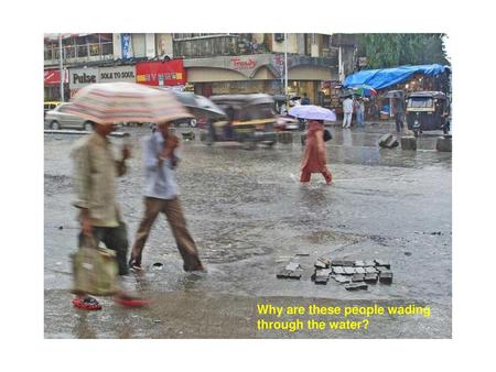 Why are these people wading through the water?