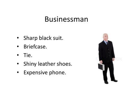 Businessman Sharp black suit. Briefcase. Tie. Shiny leather shoes.